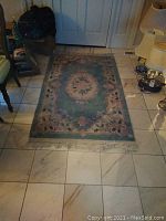 4x6 rug laid on tiled floor, front view