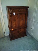 Front view of the dresser showing cabinet door and drawers