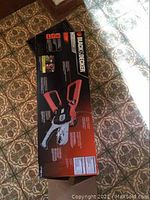 Full boxed packaging of Black & Decker Alligator Lopper showing branding and product image.