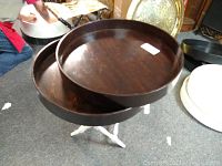 Two stacked large dark wooden trays on a white folding stand, showing shape and size.