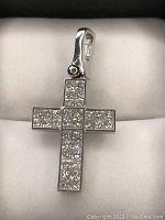 Front view of cross pendant showing diamond layout