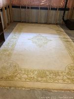 Full-view of rug laid flat on floor showing overall size and pattern