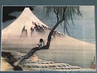 Close-up of the Japanese style print showing the boy on a tree branch and Mount Fuji.