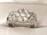 Front view of ring showing flower motif diamond cluster