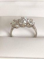 Front view showing three diamonds set side by side on platinum band