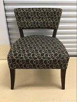 Front view of the accent chair showing seat and backrest upholstery pattern.
