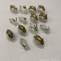 Overhead view of 14 ornaments arranged on table