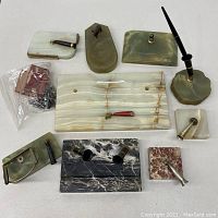 Full layout of all desk set items on white background showing color, shape, and condition.