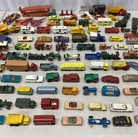 Overview of full lot showing rows of various diecast vehicles.
