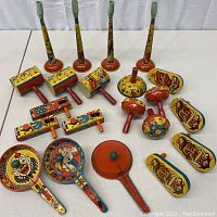 Overview of entire lot showing all assorted noisemakers