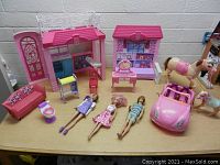 Full view of lot items including Barbies, playsets, horse, dog, furniture and carriage