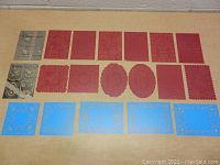 Overview of all 19 metal stencils arranged in three rows by color