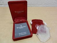 Waterford Crystal red velvet presentation box with 'Twelve Days of Christmas' booklet inside, red velvet pouch and clear crystal ornament.