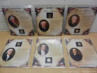Photo showing six United States Presidential coins mounted on individual photo pages with portraits and bios of the presidents