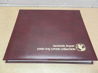 Closed view of burgundy leather-bound Reader's Digest First Day Covers Stamp Collection album with gold embossed lettering.