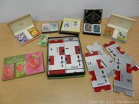 Lot displayed on table showing multiple vintage double decks and card holders arranged with score pads
