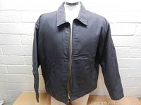 Front view of men's Dickies jacket on a mannequin showing front zipper, collar, and sleeve details.