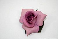 Top view of the pink rose brooch showing detailed petals and coloration.