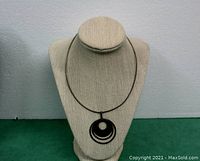 Front view of the choker style sterling silver necklace displayed on a bust stand, showing the full necklace and pendant detail.