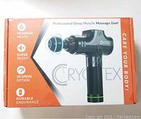 Box showing Cryotex professional deep muscle massage gun features including 6 massage heads, super silent operation, 20 speed options, and durable endurance.