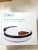 Box of PetWant 5 Meals Automatic Pet Feeder model PF-105 showing front packaging with product image and branding.