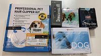 Opened box of professional pet hair clipper kit labeled with features and images of a dog, showing the packaging and some accessories.