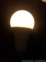 Photo of a lit LED bulb showing bulb shape and brightness