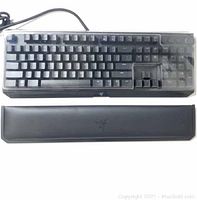 Top-down view of black Razer BlackWidow Elite keyboard with attached USB cable and magnetic wrist rest below keyboard.