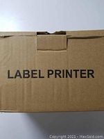 Box labeled 'Label Printer' showing original packaging.