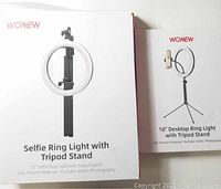 Box showing 12-inch selfie ring light with tripod stand, including phone holder, labeled for live streaming, makeup, YouTube, video, photography.