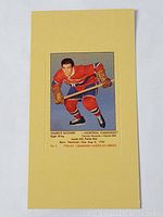 Tall boy hockey card featuring Maurice Richard in Montreal Canadiens uniform, perforated but never removed.