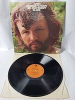 Kris Kristofferson Me and Bobby McGee vinyl record with cover, record shown outside the cover displaying the orange label on black vinyl.