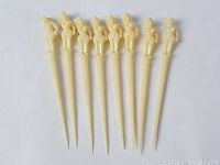 Full view of the eight skewers lined up showing the length and figure detail.