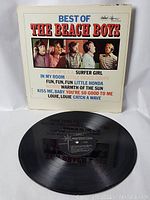Front cover of The Beach Boys Best Of vinyl LP showing band photo and song titles.