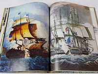 Open book showing vivid, detailed color illustrations of historic sailing warships engaged in battle, with smoke and flags visible.