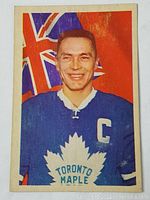Front of 1963-64 Parkhurst hockey card featuring George Armstrong in Toronto Maple Leafs captain uniform with Ontario flag background.