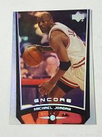 Front of the 1999 Upper Deck Encore Michael Jordan basketball card showing an action photo of Jordan dribbling in a Bulls uniform.