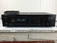 Front view of the Onkyo TX-800 showing the digital display for tuning and volume knob.