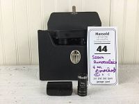 Sears binoculars in black case with metal clasp, alongside the Emoskop optical device and a lens cap.