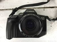 Front view of Canon EOS 650 camera body with Canon EF 50mm 1.8 lens attached showing lens markings and camera model.