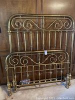 Front view of headboard and footboard leaned against wall