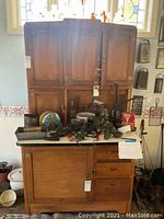 Front view showing overall cabinet structure, tile countertop, drawers and upper hutch