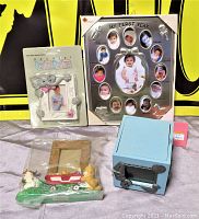 Lot of four baby collectibles showing various angles of all items together and individually