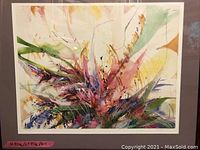 Abstract floral wall art with vibrant colors in gray frame