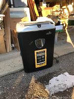 Front view of the Fellowes paper shredder showing control panel and branding.
