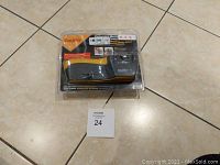 Front view of Smith's electric knife sharpener sealed in packaging showing branding and product details.