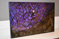 Angled front view showing full composition of the purple, black and gold abstract painting on gallery-wrapped canvas.