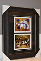 Full front view of the framed artwork showing both prints and overall condition.