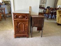 Two wood side tables side by side in a room