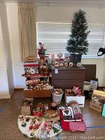 Wide shot of entire lot showing boxes, bins, dresser drawers, pre-lit tree, linens, tins, ornaments